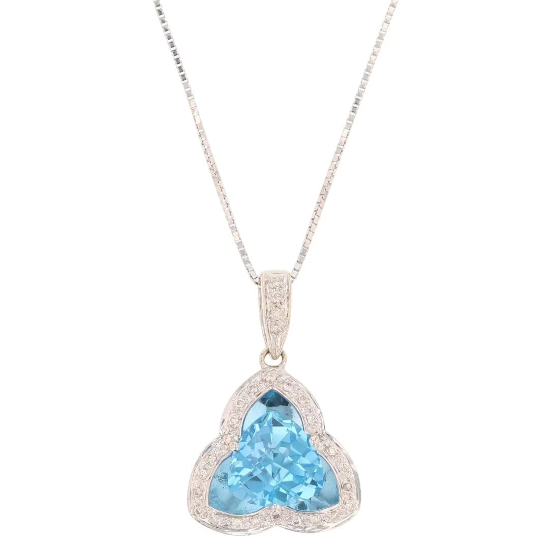 TRILLION BLUE TOPAZ W/ DIAMOND HALO PENDANT NECKLACE: Trillion Blue Topaz w/ Diamond Halo Pendant Necklace Brand: Unbranded Type: Necklace Material: 14k White Gold Main Stone/Creation Natural Color: Main Stone Color: Medium Moderately Strong Very