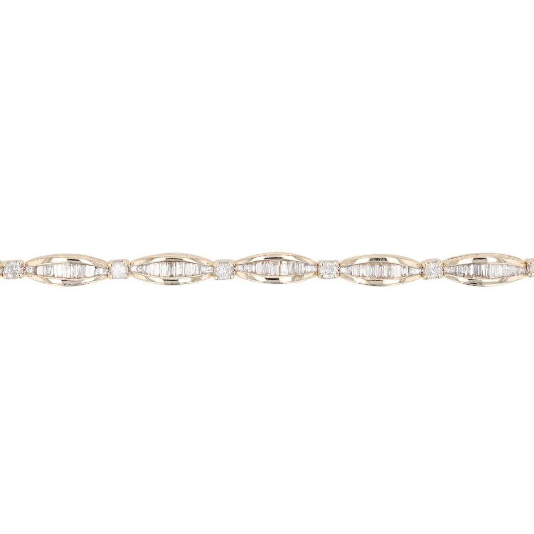 BAGUETTE AND ROUND DIAMOND TENNIS BRACELET: Baguette and Round Diamond Tennis Bracelet Brand: Unbranded Type: Bracelet Material: 10k Yellow Gold Main Stone/Creation Natural Color: None Size: Bracelet Measurement: 7" Length / 4.3mm 
