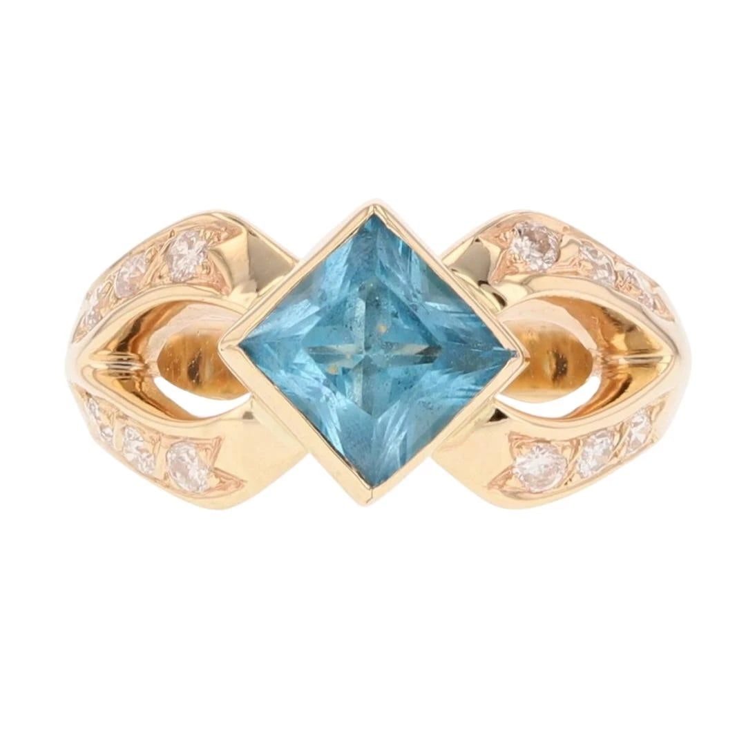 SQUARE CUT BLUE TOPAZ WITH DIAMOND ACCENTS RING: Square Cut Blue Topaz with Diamond Accents Ring Brand: Unbranded Type: Ring Material: 14k Yellow Gold Main Stone/Creation Blue Topaz Color: Main Stone Color: Medium Blue Size: 4.5 US 