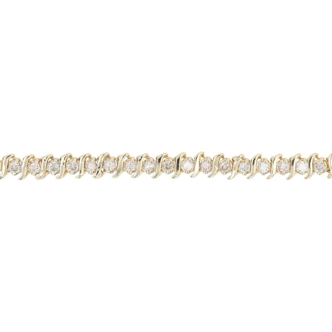 ROUND CUT DIAMOND TENNIS BRACELET 14K YELLOW GOLD: Round Cut Diamond Tennis Bracelet 14k Yellow Gold Brand: Unbranded Type: Bracelet Material: 14k Yellow Gold Main Stone/Creation Natural Color: None Size: Bracelet Measurement: 7" Length /