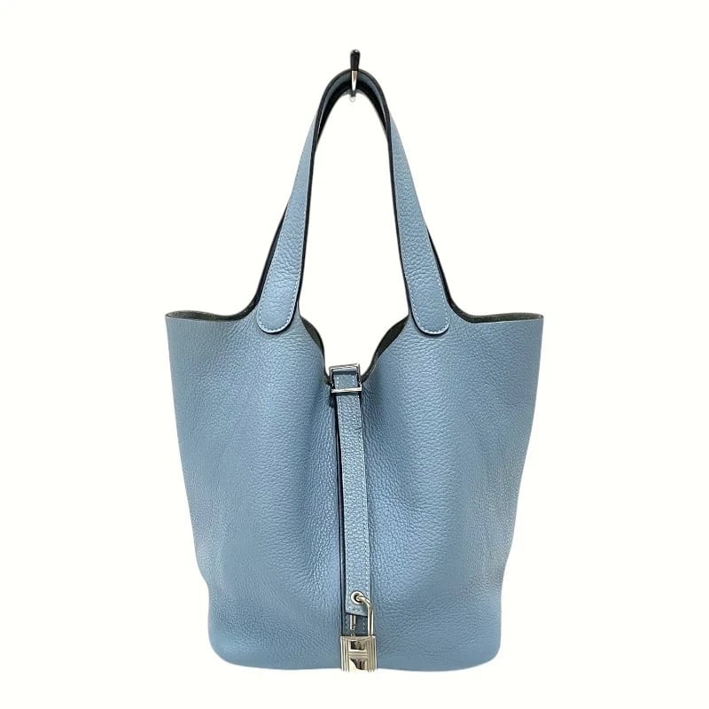 HERMES PICO TAN LOCK MM HANDBAG: HERMES Pico Tan Lock MM Handbag Brand: HERMES Type: Handbag Material: Taurillon Clemence Color: Blue Atoll SilverHardware Size: W8.7 x H8.3x D6.7inch Accessories: None Accessories Notice:
