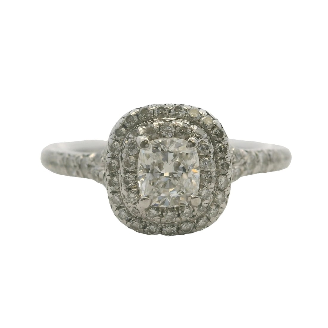 TIFFANY & CO PLATINUM SOLESTE CUSHION-CUT DIAMOND HALO RING: Tiffany & Co Platinum Soleste Cushion-Cut Diamond Halo Ring Brand: Tiffany & Co Type: Ring Material: 950 Platinum Main Stone/Creation Natural Color: Platinum Size: 6 US Accessories: None A
