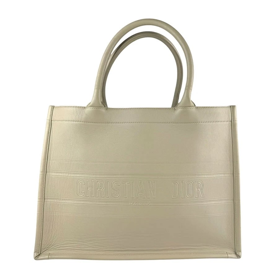 CHRISTIAN DIOR BOOK TOTE MEDIUM HANDBAG BEIGE: Christian Dior Book Tote Medium Handbag Beige Brand: Christian Dior Type: Handbag Material: Leather Color: Beige Size: W:13.8inx H:10.6inx D:6.7in Shoulder Length: 15.7in Accessories: None