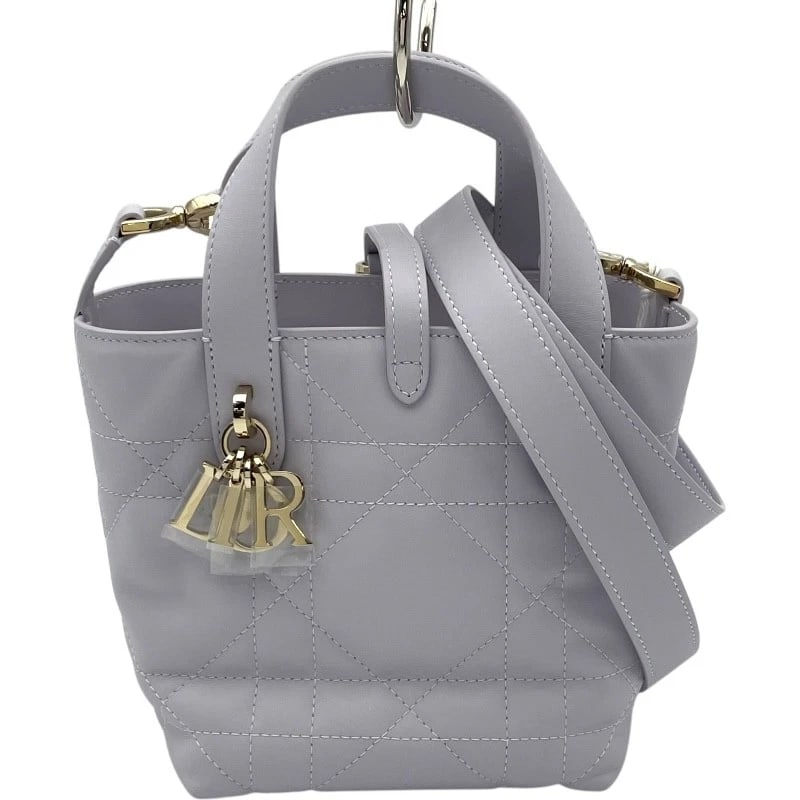CHRISTIAN DIOR DIOR TOUJOURS PARTICLE NANO TOTE BAG: Christian Dior Dior Toujours Particle Nano Tote Bag Brand: Christian Dior Type: Tote Bag Material: Macrocannage/Calfskin Color: Lavender GDHardware Size: W5.1 x H5.9x D4.7inch Shoulder:40.0inch A