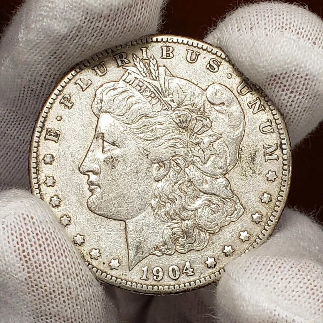 1904-S $1 MORGAN SILVER DOLLAR - LUSTER: 1904-S $1 Morgan Silver Dollar - Luster Brand/Mint: None Year: 1904 Fineness: Composition: Silver Coin: Morgan Denomination: $1 Country of Origin: United States Accessories: None