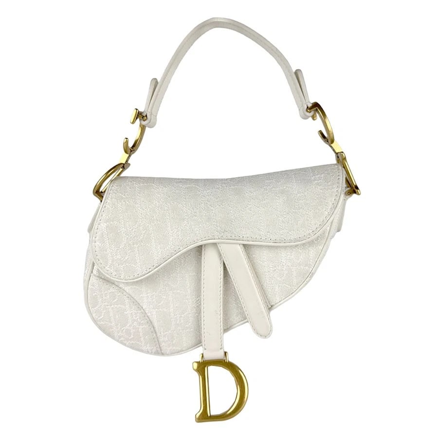 CHRISTIAN DIOR SADDLE HANDBAG WHITE/GOLD CANVAS: Christian Dior Saddle Handbag White/Gold Canvas Brand: Christian Dior Type: Handbag Material: Canvas x Leather Color: White Size: W:6.3inx H:5.5inx D:1.6in Shoulder Length: 13.8in Accessories: No