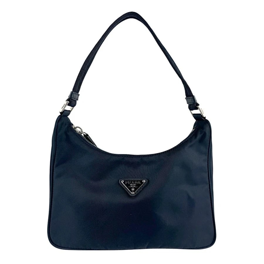 PRADA HANDBAG NAVY NYLON/SILVERTONE: PRADA Handbag Navy Nylon/Silvertone Brand: PRADA Type: Handbag Material: Nylon Color: Navy Size: W:8.3inx H:4.7inx D:2.4in Handle Length:12.2in Accessories: None Accessories Notice: When p