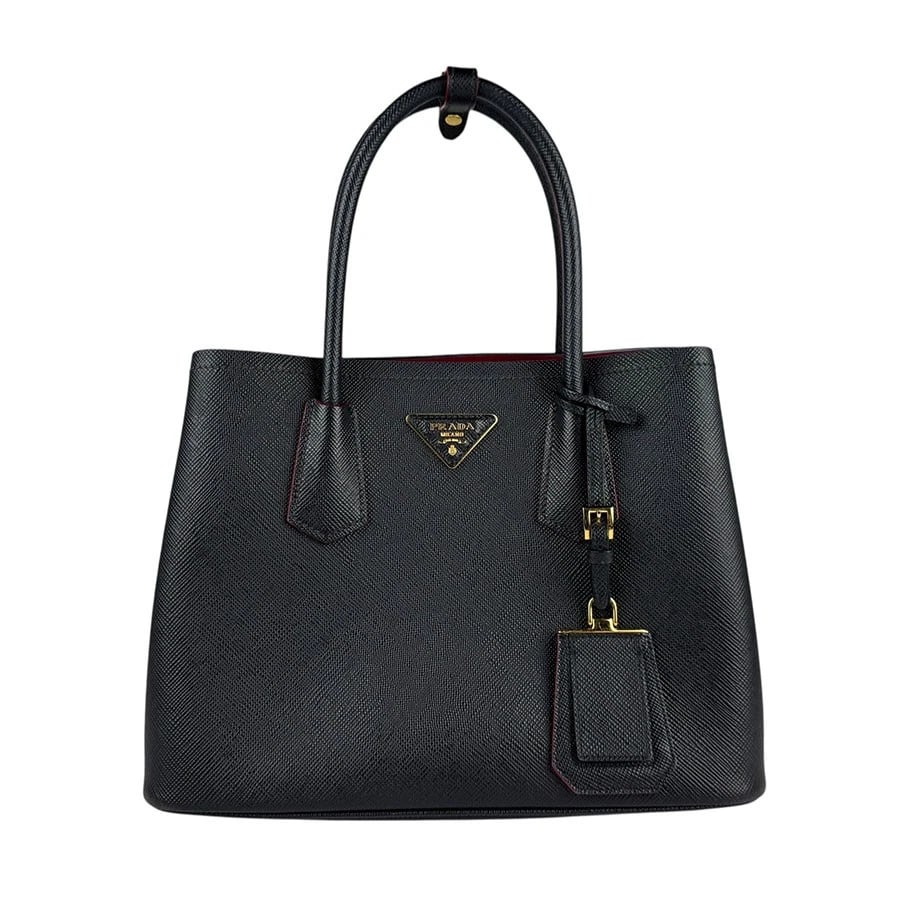 PRADA LOGO HANDBAG BLACK LEATHER/GOLDTONE: PRADA Logo Handbag Black Leather/Goldtone Brand: PRADA Type: Handbag Material: Leather Color: Black Size: W:11.8inx H:9.1inx D:5.5in Handle Length:15.7in Accessories: None Accessories Noti