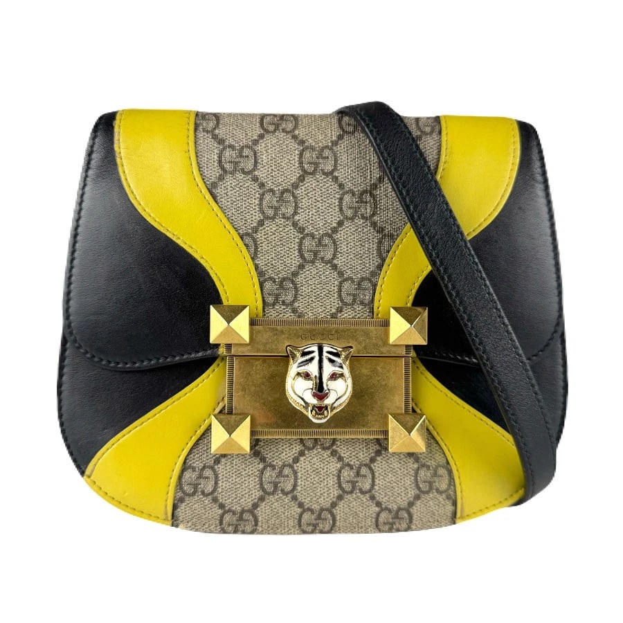 GUCCI GG SUPREME TIGER HEAD SHOULDER BAG: GUCCI GG Supreme Tiger Head Shoulder Bag Brand: GUCCI Type: Shoulder Bag Material: PVC x Leather Color: Black X Yellow X Brown Size: W:7.9inx H:6.7inx D:1.2in Shoulder Length: 35.4in 