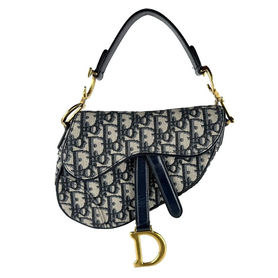 CHRISTIAN DIOR OBLIQUE SADDLE HANDBAG NAVY: Christian Dior Oblique Saddle Handbag Navy Brand: Christian Dior Type: Handbag Material: Canvas Color: Navy Size: W:5.9inx H:5.9inx D:1.6in Shoulder Length: 13.8in Accessories: None Access