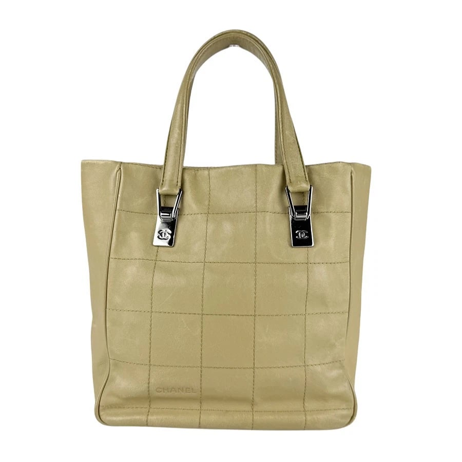 CHANEL CHOCOLATE BAR HANDBAG TOTE BAG: CHANEL Chocolate Bar Handbag Tote Bag Brand: CHANEL Type: Handbag Material: Leather Color: Khaki Beige Size: W:9.1inx H:9.8inx D:4.7in Handle Length:16.9in Accessories: None Accessories No