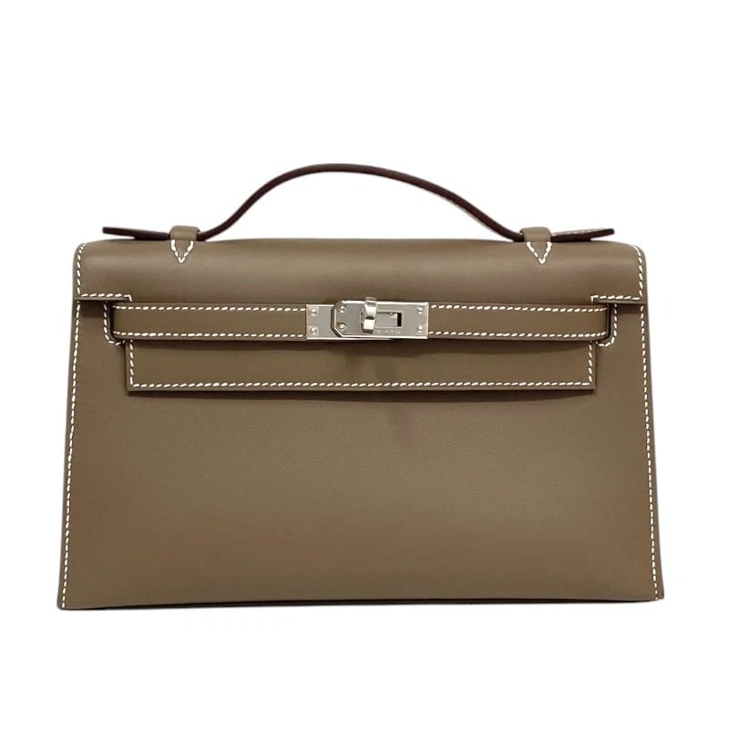 HERMES POCHETTE KELLY HANDBAG: HERMES Pochette Kelly Handbag Brand: HERMES Type: Handbag Material: Swift Color: Etop SilverHardware Size: W8.5 x H5.1x D2.6inch Accessories: None Accessories Notice: When purchasing pre-o