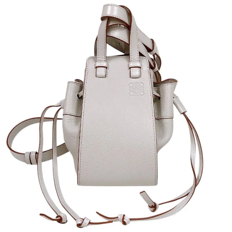 LOEWE HAMMOCK DRAWSTRING BAG MINI SHOULDER BAG: LOEWE Hammock Drawstring Bag Mini Shoulder Bag Brand: LOEWE Type: Shoulder Bag Material: Calfskin Color: Ivory Size: W7.9 x H7.9x D5.9inch Accessories: None Accessories Notice: When purcha