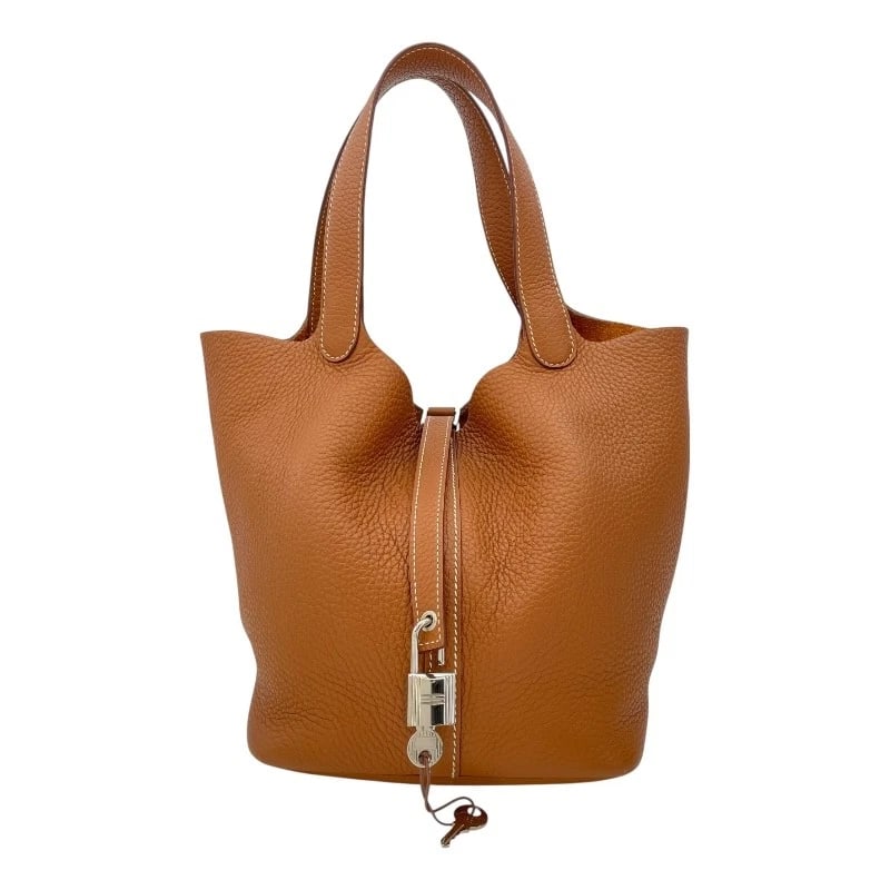 HERMES PICO TAN LOCK MM HANDBAG: HERMES Pico Tan Lock MM Handbag Brand: HERMES Type: Handbag Material: Taurillon Clemence Color: Gold SV Hardware Size: W8.7 x H8.5x D6.7inch Accessories: None Accessories Notice: When purc