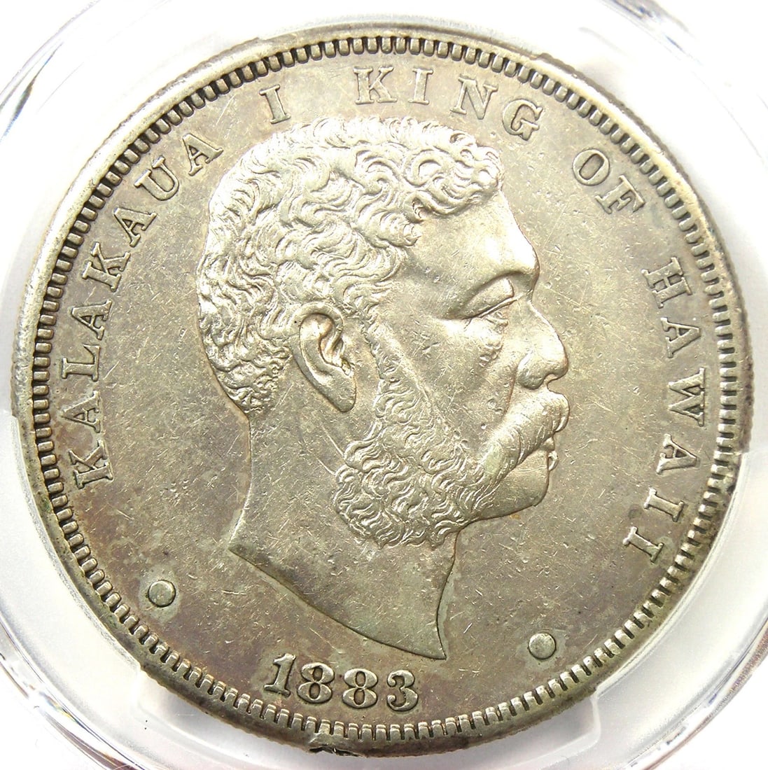 1883 HAWAII KALAKAUA DOLLAR $1 SILVER COIN: 1883 Hawaii Kalakaua Dollar $1 Silver Coin Composition: Silver Year: 1883 Denomination: $1 Fineness: 0.9 Country of Origin: United States Accessories: None Accessories Notice: When purchas