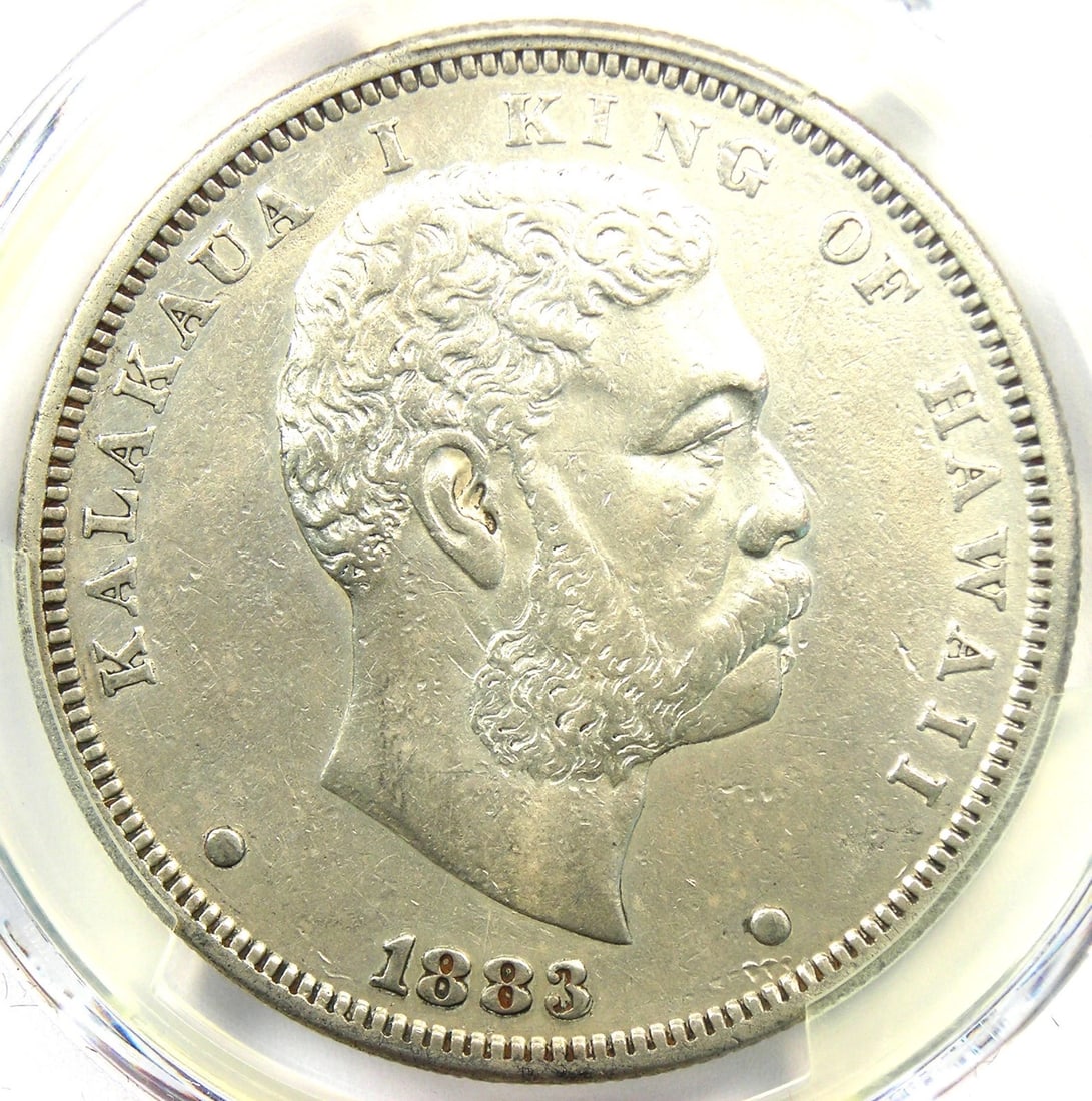 1883 HAWAII KALAKAUA DOLLAR $1 SILVER COIN: 1883 Hawaii Kalakaua Dollar $1 Silver Coin Composition: Silver Year: 1883 Denomination: $1 Fineness: 0.9 Country of Origin: United States Accessories: None Accessories Notice: When purchas