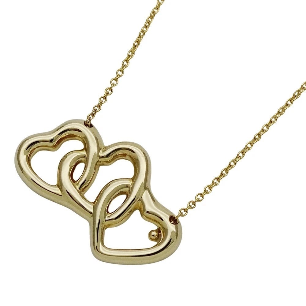 TIFFANY & CO. TRIPLE HEART PENDANT NECKLACE 18K YELLOW GOLD: Tiffany & Co. Triple Heart Pendant Necklace 18K Yellow Gold Brand: Tiffany & Co. Type: Necklace Material: 18K Yellow Gold Color: Yellow Gold Size: Height: 0.55 in (14 mm) Width: 0.96 in (24.5 mm)