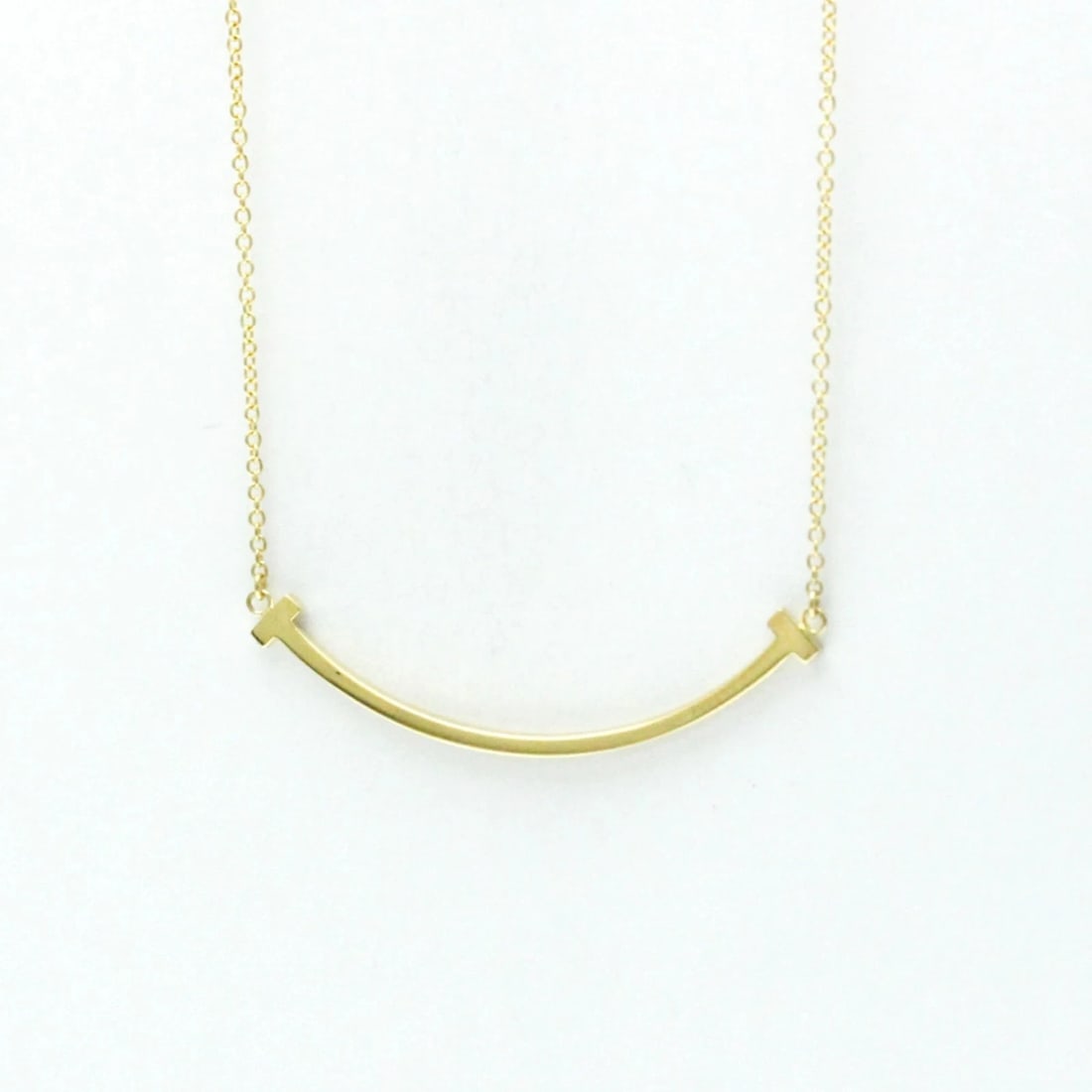 TIFFANY & CO. T SMILE PENDANT NECKLACE K18 YELLOW GOLD: Tiffany & Co. T Smile Pendant Necklace K18 Yellow Gold Brand: Tiffany & Co. Type: Necklace Material: K18 Yellow Gold Color: Yellow Gold Size: Length: 15.94'' - 17.91'' (40.5 cm - 45.5 cm) Accesso