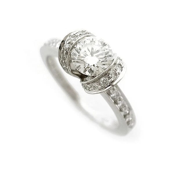 TIFFANY & CO. RIBBON DIAMOND RING PT950: Tiffany & Co. Ribbon Diamond Ring Pt950 Brand: Tiffany & Co. Type: Ring Material: Platinum Main Stone/Creation Natural Color: Silver Size: 5.25 US Accessories: None Accessories Notice: Whe