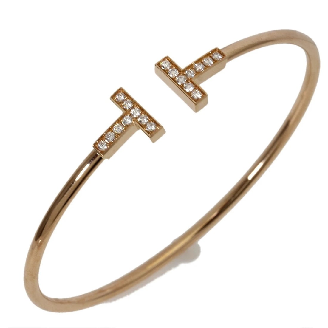 TIFFANY & CO. T WIRE DIAMOND BRACELET 18K ROSE GOLD: Tiffany & Co. T Wire Diamond Bracelet 18K Rose Gold Brand: Tiffany & Co. Type: Bracelet Material: 18K Rose Gold Main Stone/Creation Sapphire Color: Rose Gold Size: Wrist Length: approx. 5.9–6.1