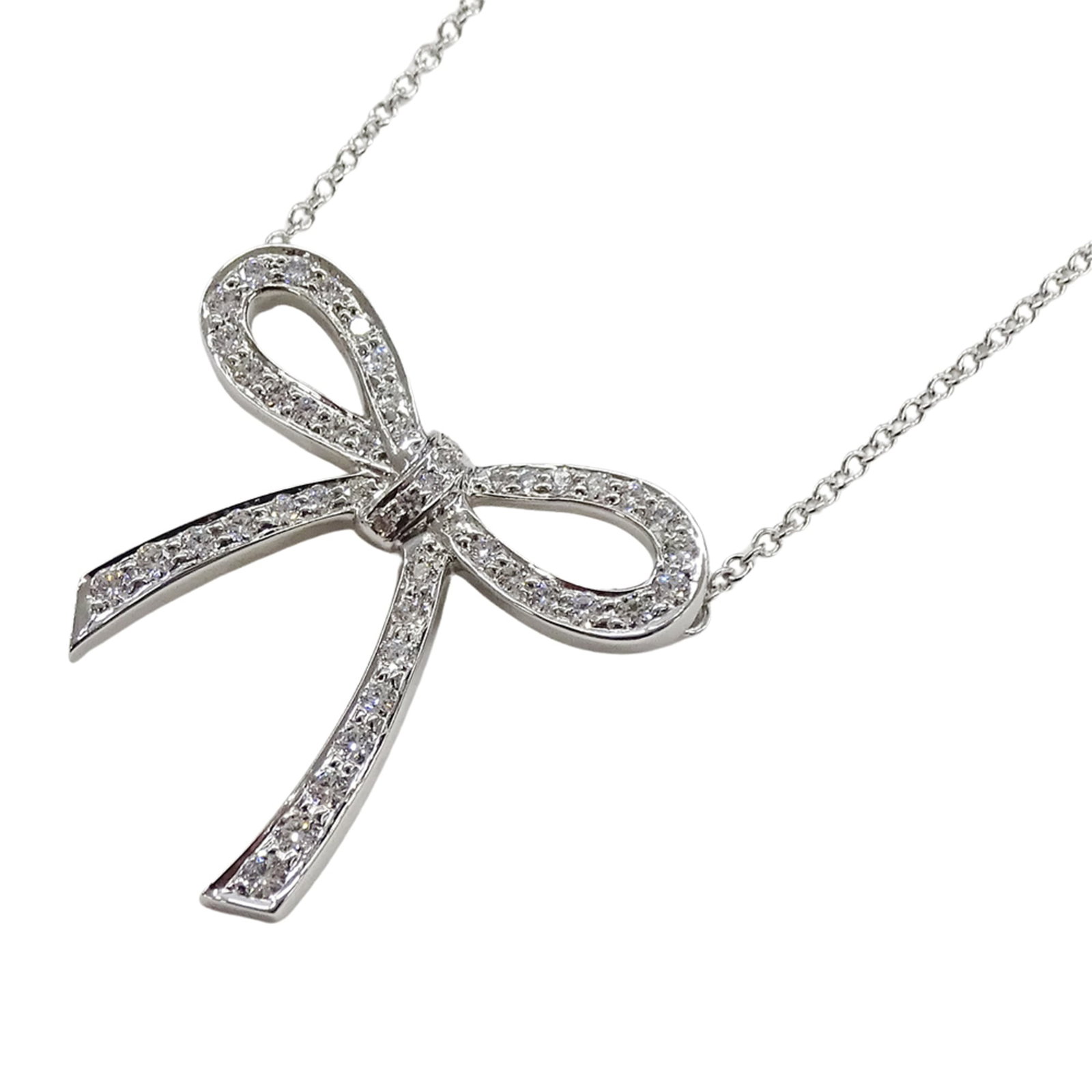 TIFFANY & CO. DIAMOND BOW RIBBON NECKLACE: Tiffany & Co. Diamond Bow Ribbon Necklace Brand: Tiffany Type: Necklace Material: Silver 925 Color: Silver Size: Neck Circumference 40.5 cm / 15.94'' Pendant Size 21.9mm x 22mm / 0.86'' x