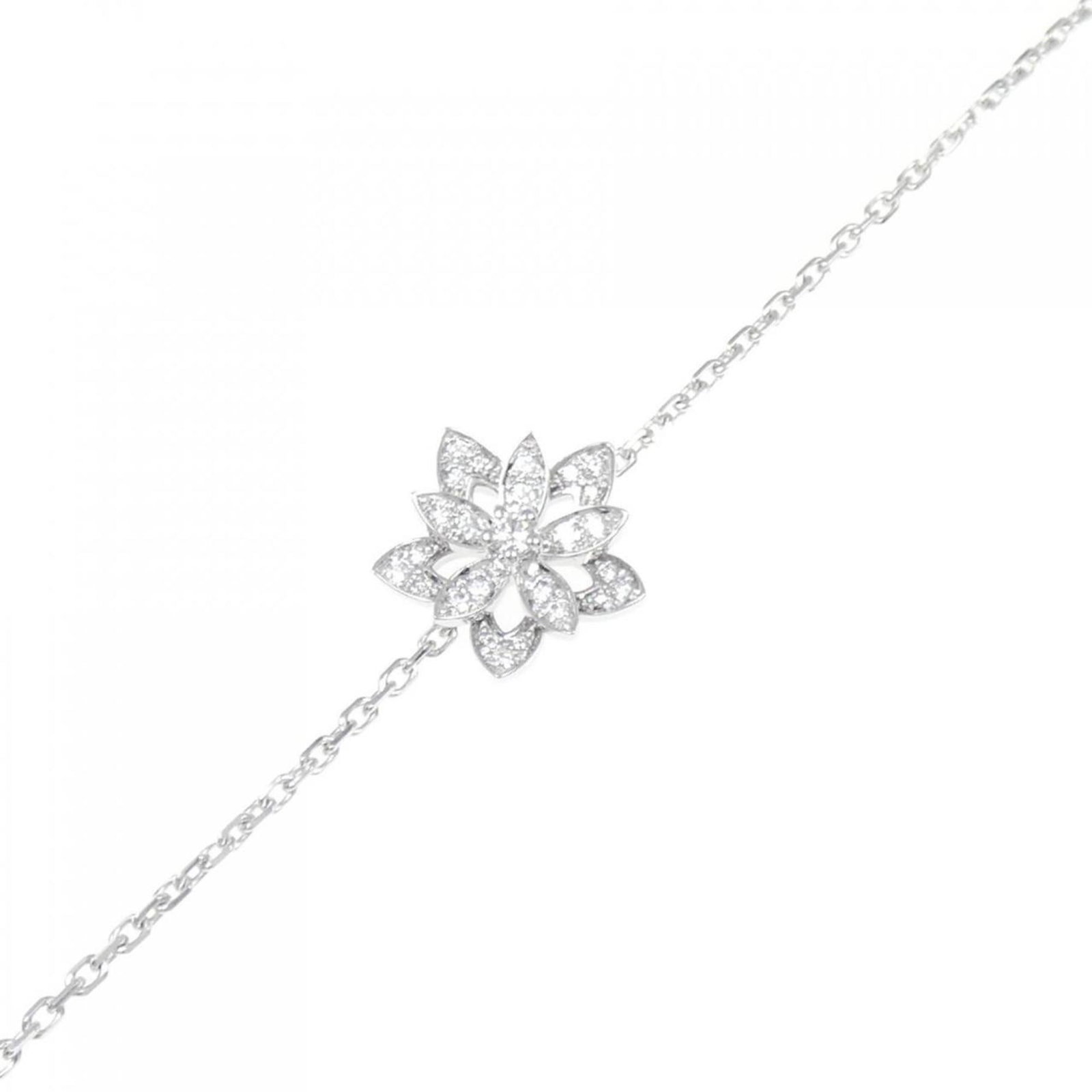 VAN CLEEF & ARPELS LOTUS MINI BRACELET: Van Cleef & Arpels Lotus Mini Bracelet Brand: Van Cleef & Arpels Type: Charm bracelet Material: White gold (18K) Color: White Size: Length 15.5cm - 17cm / 6.1'' - 6.69'' Width 1.21cm / 0.47'' 