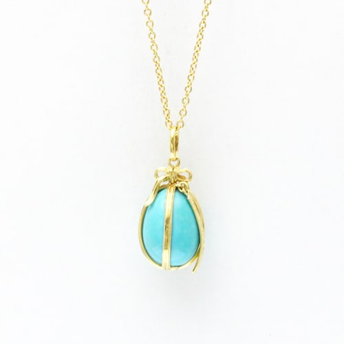 TIFFANY JEAN SCHLUMBERGER TURQUOISE EGG NECKLACE: TIFFANY Jean Schlumberger Turquoise Egg Necklace Brand: Tiffany Type: Pendant necklace Material: Yellow gold (18K) Color: Gold Size: Neck Circumference 46 cm / 18.11'' Pendant Size 21.2mm x