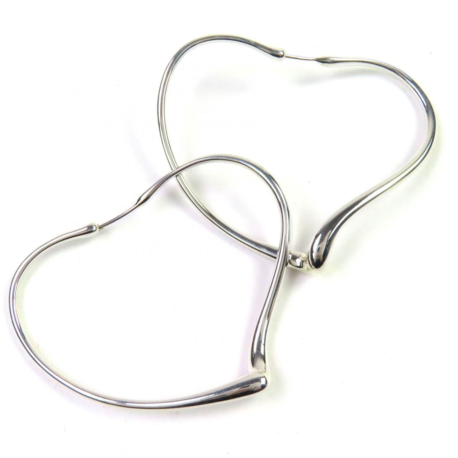 TIFFANY ELSA PERETTI OPEN HEART HOOP EARRINGS: Tiffany Elsa Peretti Open Heart Hoop Earrings, Brand: Tiffany Type: Hoop earrings Material: Silver 925 Color: Silver Size: (HxWxD) 40.00mm x 50.00mm / 1.57'' x 1.97'' Accessories: None