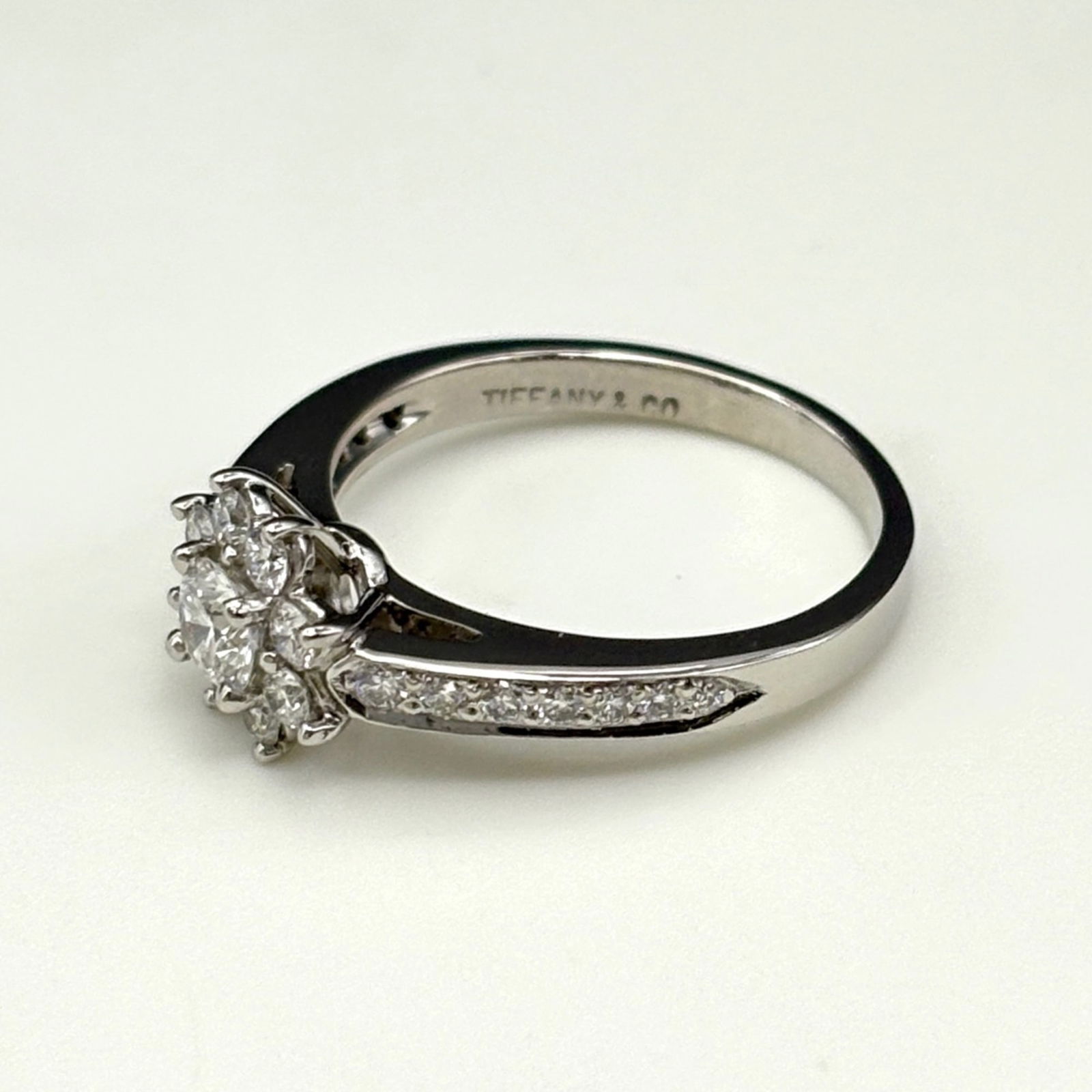 TIFFANY & CO. FLORA RING PLATINUM DIAMOND: Tiffany & Co. Flora Ring, Platinum, Diamond Brand: Tiffany Type: Band ring Material: Platinum950 Color: Platinum Size: 5.5 US Accessories: None Accessories Notice: When purchasing pre-owned