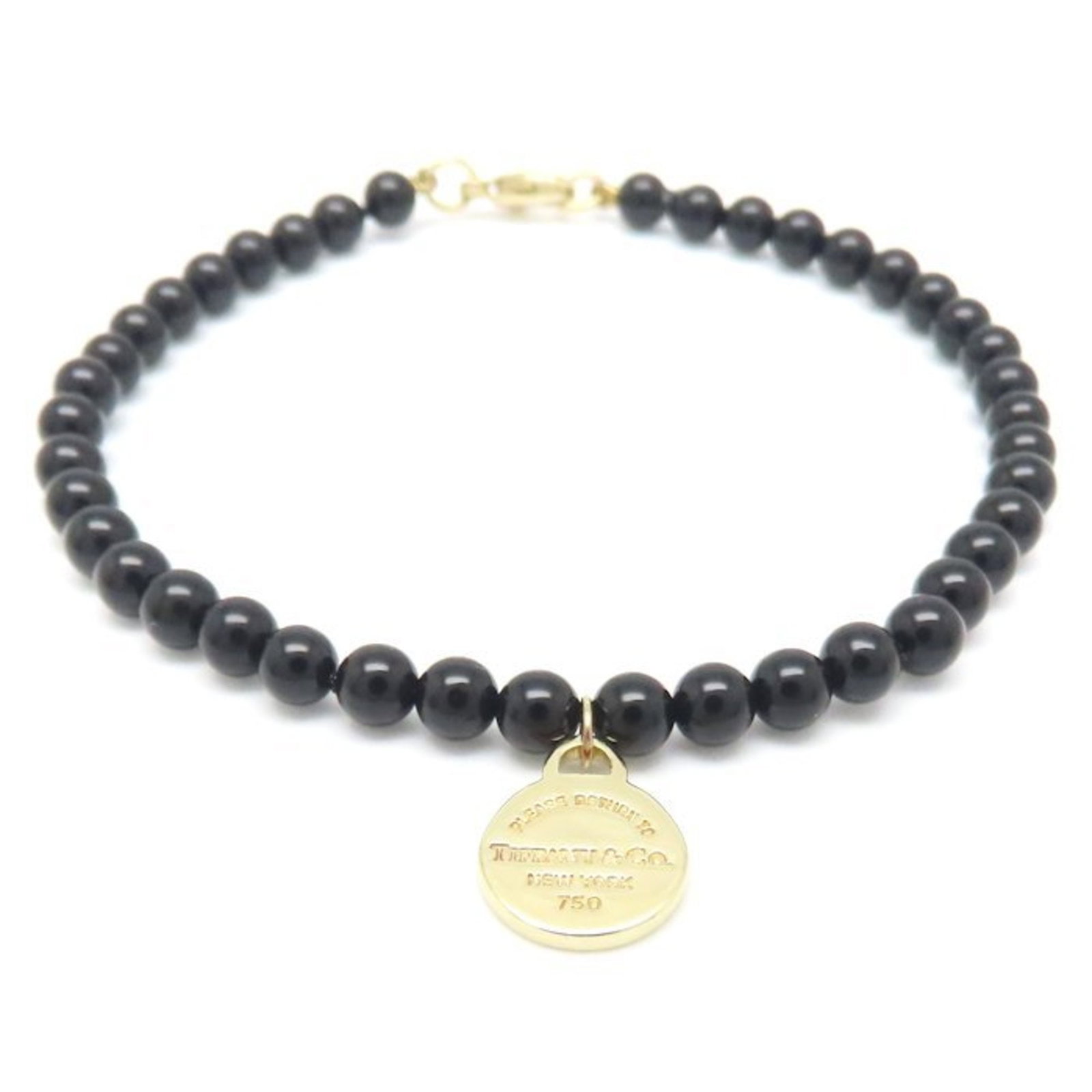 TIFFANY & CO. ROUND TAG BRACELET: Tiffany & Co. Round Tag Bracelet Brand: Tiffany Type: Charm bracelet Material: 18K White Gold Color: Yellow Size: Length 14.5cm / 5.7'' Total Length 17.5cm / 6.88'' Accessories: None