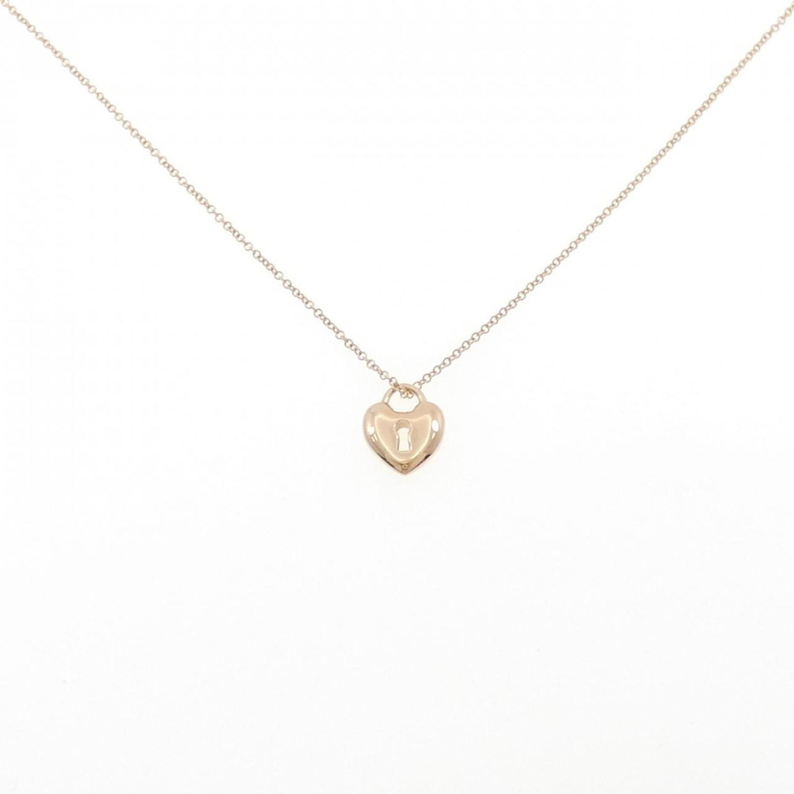 TIFFANY HEART LOCK MINI NECKLACE: TIFFANY Heart Lock Mini Necklace Brand: Tiffany Type: Necklace Material: Pink gold (18K) Color: Pink gold Size: Neck Circumference 40 cm / 15.74'' Pendant Size 11.4mm x 9.3mm / 0.44'' x 0.36''