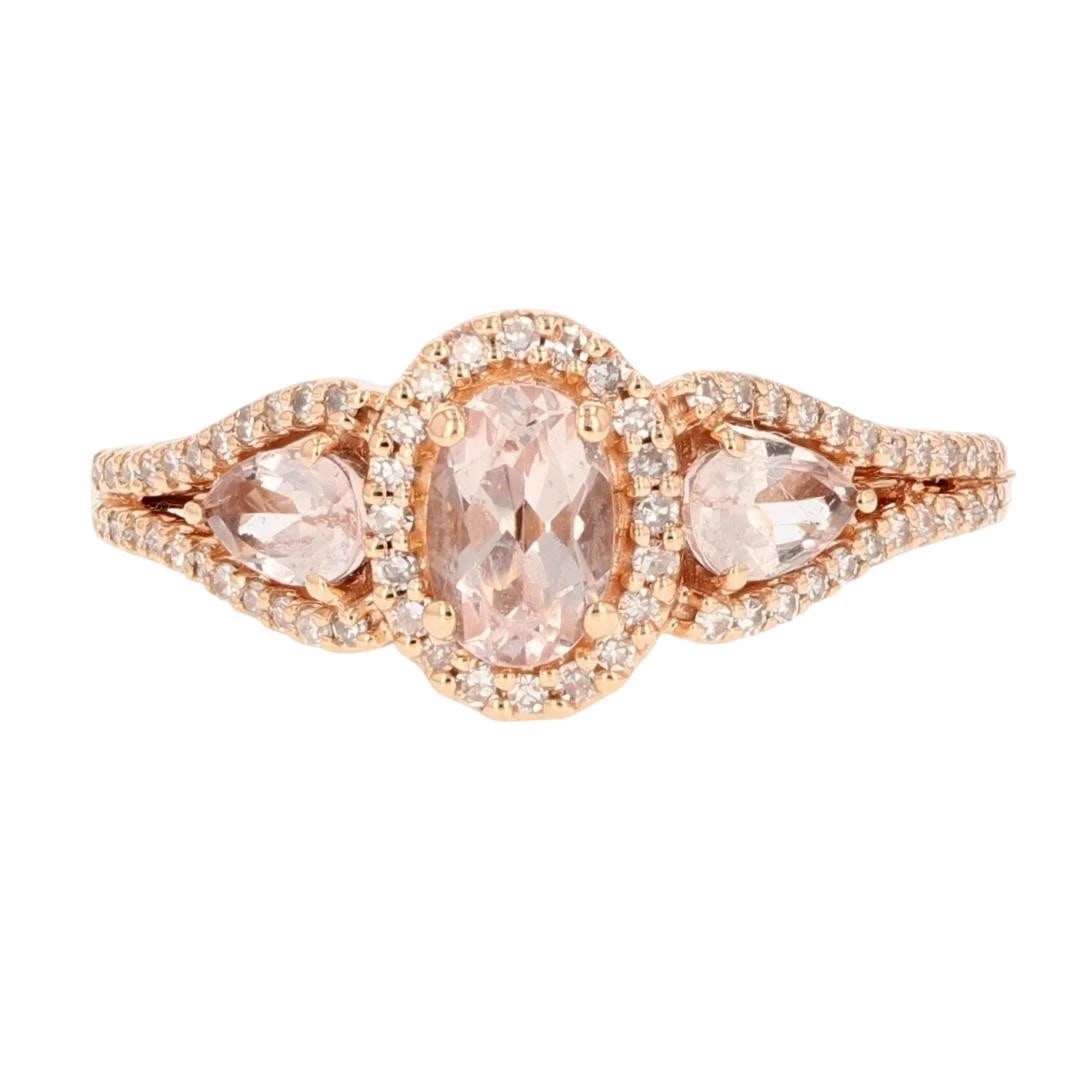 OVAL MORGANITE WITH DIAMOND HALO THREE-STONE RING: Oval Morganite with Diamond Halo Three-Stone Ring Brand: Unbranded Type: Ring Material: 10k Yellow Gold Main Stone/Creation Natural Color: Main Stone Color: Very Light Very Slightly Brownish