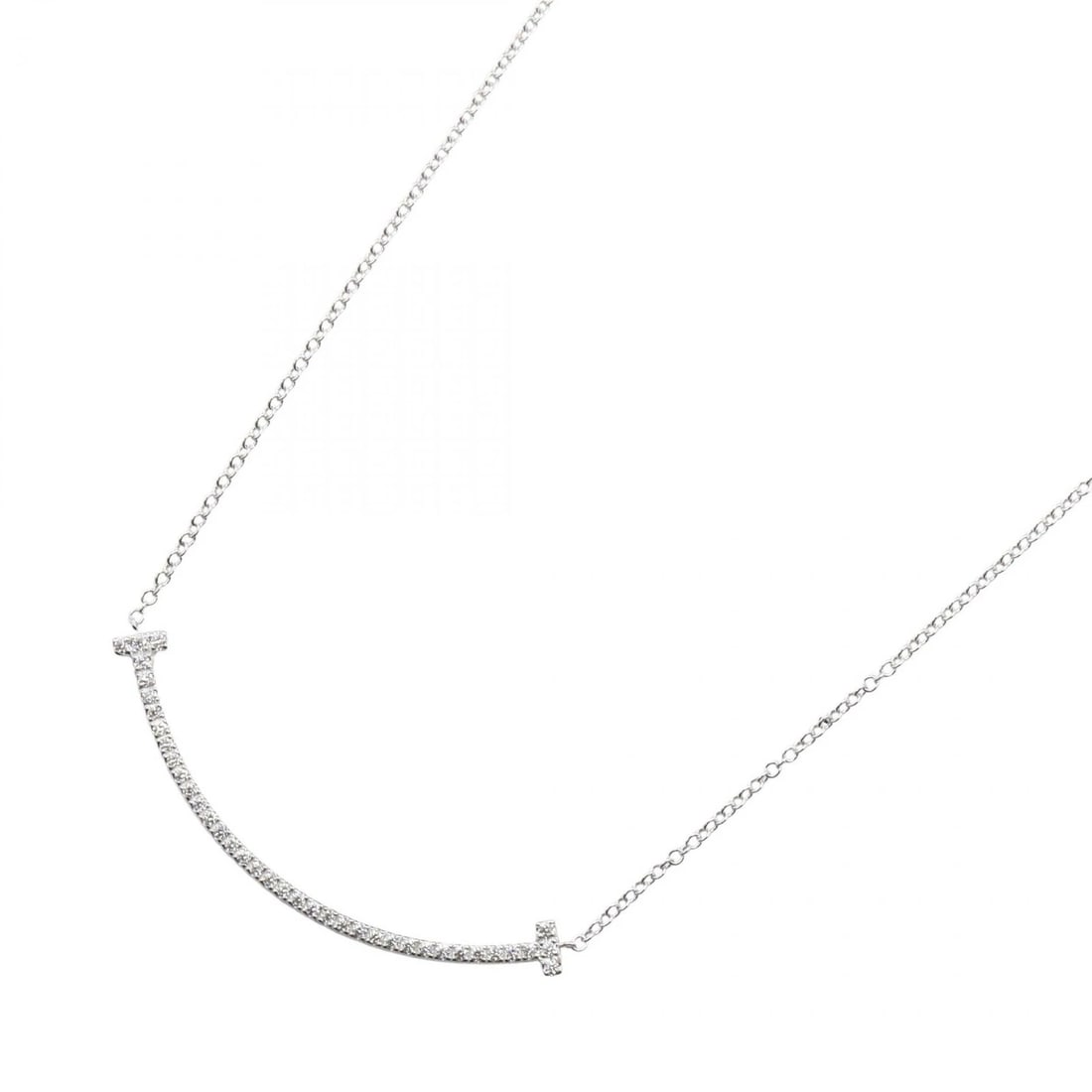 TIFFANY?CO T SMILE SMALL DIAMOND NECKLACE 18KWG: TIFFANY?CO T Smile Small Diamond Necklace 18KWG Brand: TIFFANY?CO Type: Necklace Material: K18WG Main Stone/Creation Natural Color: Silver Size: Neck rotation?46cm(18.1") Motif W?36mm x H?3mm(1.4"