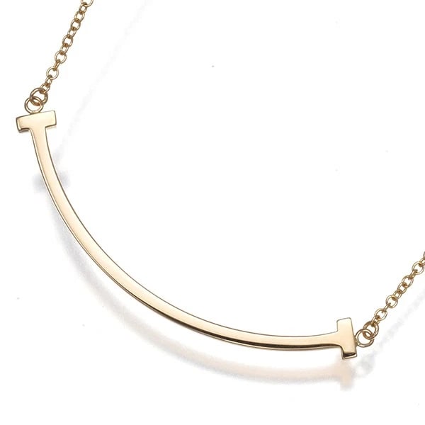 TIFFANY&CO. NECKLACE TIFFANY T SMILE SMALL: Tiffany&Co. Necklace Tiffany T Smile Small Brand: Tiffany & Co. Type: Necklace Material: 18K / 750 / Rose Gold Color: Rose Gold Size: Necklace length: 40 - 45cm Pendant size: 9.5 x 37.0mm Accesso