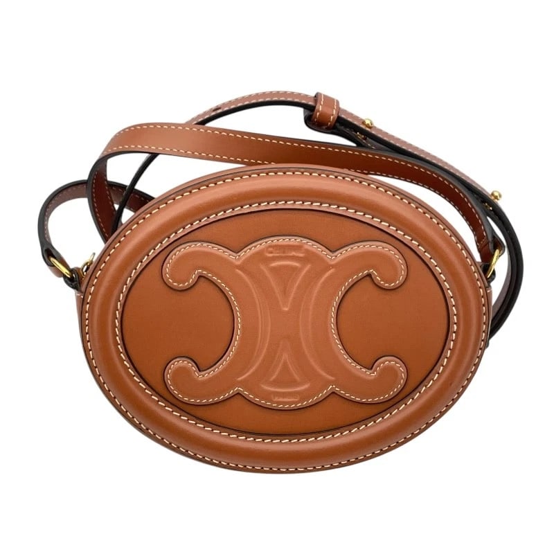 CELINE CROSSBODY OVAL PURSE TRIOMPHE SHOULDER BAG: CELINE Crossbody Oval Purse Triomphe Shoulder Bag Brand: CELINE Type: Shoulder Bag Material: smooth scarf Color: Tan Size: W6.3 x H4.7x D2.0inch Accessories: None Accessories Notice: When