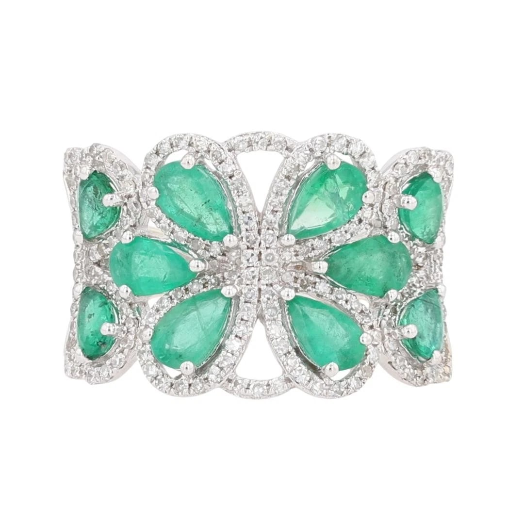 EFFY PEAR SHAPED EMERALD AND DIAMOND FLORAL RING: EFFY Pear Shaped Emerald and Diamond Floral Ring Brand: Effy Type: Ring Material: 14k White Gold Main Stone/Creation Emerald Color: Main Stone Color: Medium Light Moderately Strong Very Slightly Bl