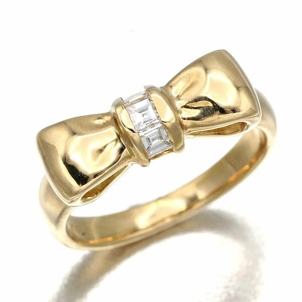 NINA RICCI DIAMOND RIBBON RING: Nina Ricci Diamond Ribbon Ring Brand: Nina Ricci Type/Style: Ring Material: K18YG, Main Stone/Creation natural Color: Gold Size: 6.5 US Accessories: None Accessories Notice: When purchasing