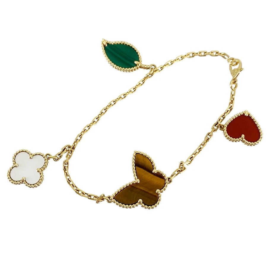 VAN CLEEF & ARPELS LUCKY ALHAMBRA YELLOW GOLD CARNELIAN TIGER EYE: Van Cleef & Arpels Lucky Alhambra Yellow gold Carnelian Tiger Eye Brand: Van Cleef & Arpels Type/Style: Bracelet Material: 18K Yellow Gold, Main Stone/Creation Carnelian Color: Gold Size: Motif si