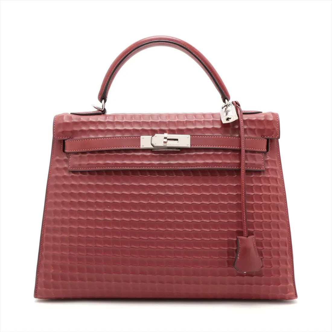 Hermes WAFFLE KELLY 32 DEUTCH ROUGE H SILVER: Hermes waffle kelly 32 Deutch Rouge H Silver Brand: Hermes Type: Hand bag Material: Deutch Color: Rouge H Size: Height:8.9inch Length:12.8inch Depth:4.5inch Handle height:3.5inch Accessories: Non