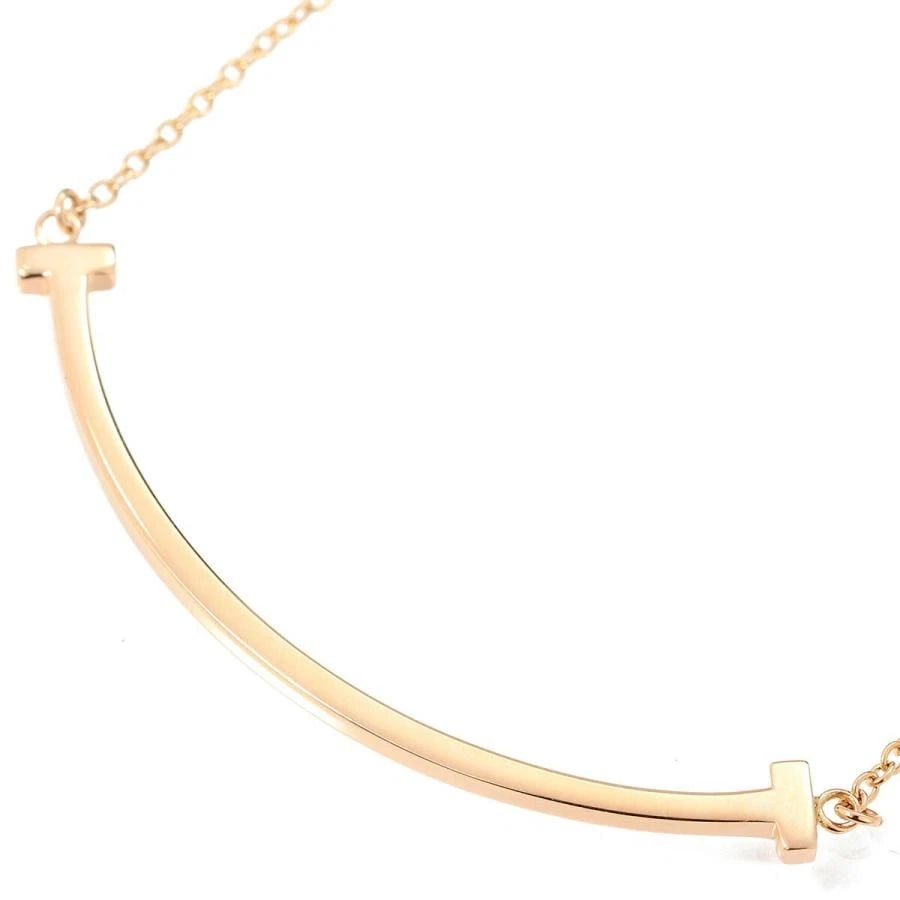 TIFFANY & CO. T SMILE SMALL K18 PINK GOLD NECKLACE: Tiffany & Co. T Smile Small K18 Pink Gold Necklace Brand: Tiffany & Co. Type/Style: Necklace Material: Metal Purity K18, Metal Pink Gold, Main Stone/Creation Natural Color: Pink Gold Size: Top Des