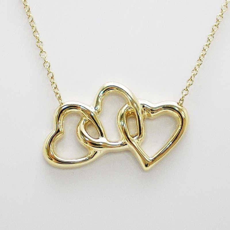 TIFFANY & CO. TRIPLE HEART K18 YELLOW GOLDNECKLACE: Tiffany & Co. Triple Heart K18 Yellow GoldNecklace Brand: Tiffany & Co. Type/Style: Necklace Material: Metal Purity K18, Metal Yellow Gold, Color: Yellow Gold Size: Total length: approx. 40cm, top