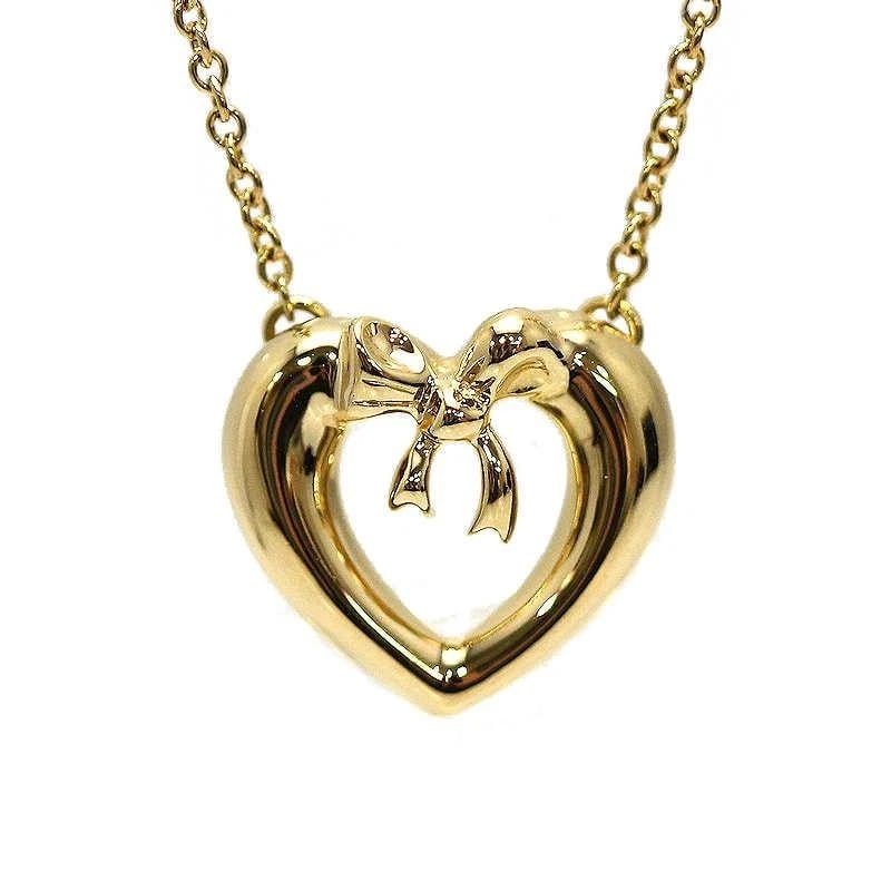 TIFFANY & CO. RIBBON HEART K18 GOLD LADIES NECKLACE: Tiffany & Co. Ribbon Heart K18 Gold Ladies Necklace Brand: Tiffany & Co. Type/Style: Necklace Material: Metal Purity K18, Metal Gold, Color: Gold Size: Total Length: Approx. 41cmTop: Approx. 1.2cm