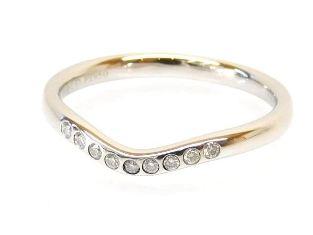 TIFFANY & CO. CURVED BAND 9 DIAMONDSPT950 RING: Tiffany & Co. Curved Band 9 DiamondsPt950 Ring Brand: Tiffany & Co. Type/Style: Ring Material: Metal Purity Pt950, Metal Platinum, Main Stone/Creation Natural Color: Platinum Size: US 5.5 Accesso