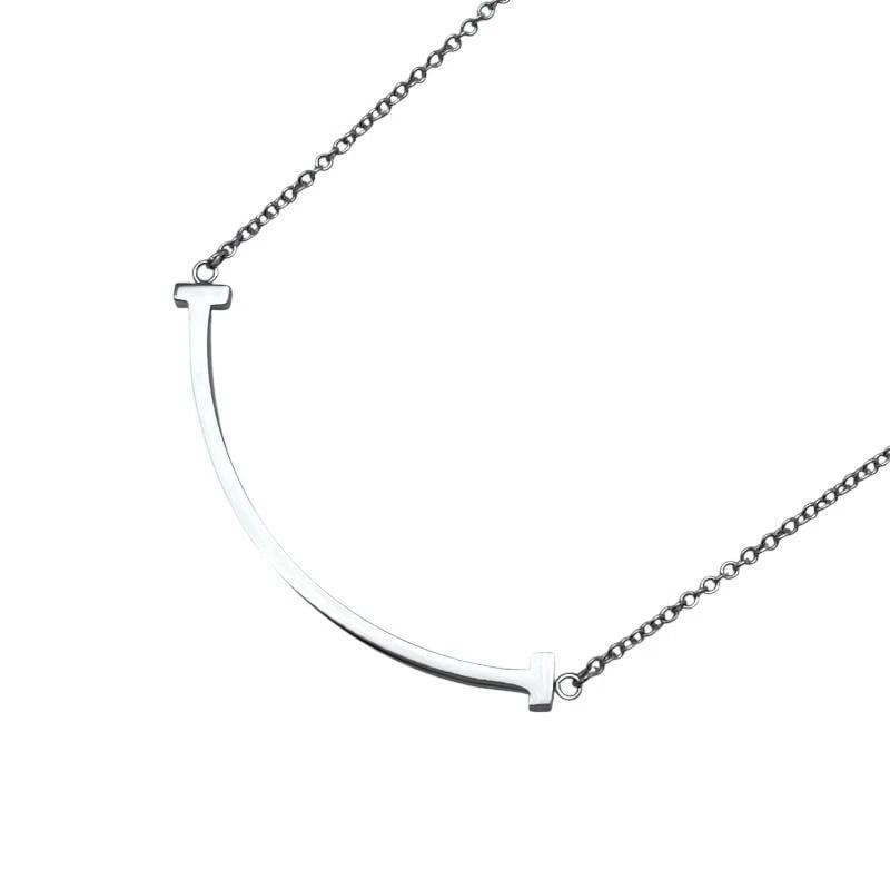 TIFFANY & CO. T SMILE 750 WHITE GOLD NECKLACE: Tiffany & Co. T Smile 750 White Gold Necklace Brand: Tiffany & Co. Type/Style: Necklace Material: Metal Purity 750, Metal White Gold, Color: White Gold Size: Length: Approx. 3.7mmWidth: Approx. 37