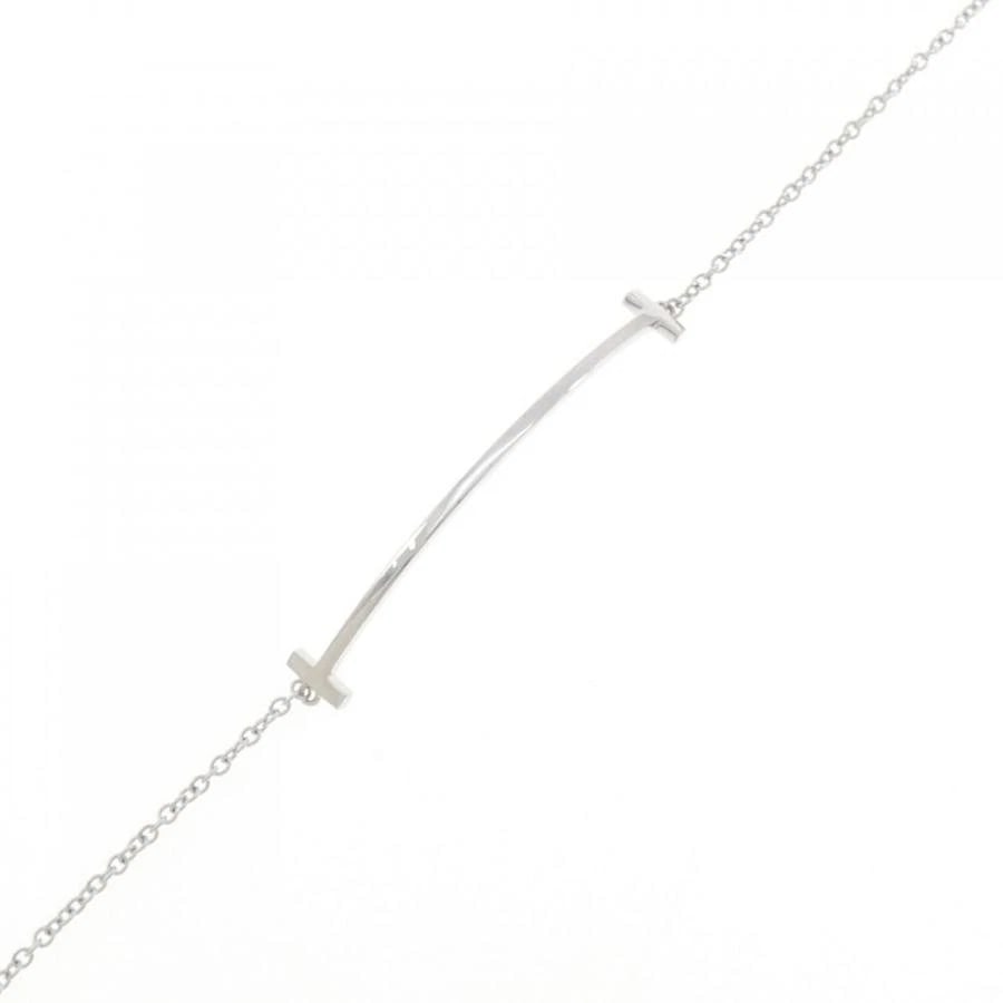 TIFFANY & CO. T SMILE K18 WHITE GOLD BRACELET: Tiffany & Co. T Smile K18 White Gold Bracelet Brand: Tiffany & Co. Type/Style: Bracelet Material: Metal Purity K18, Metal White Gold, Main Stone/Creation Natural Color: White Gold Size: 16.5cmActu