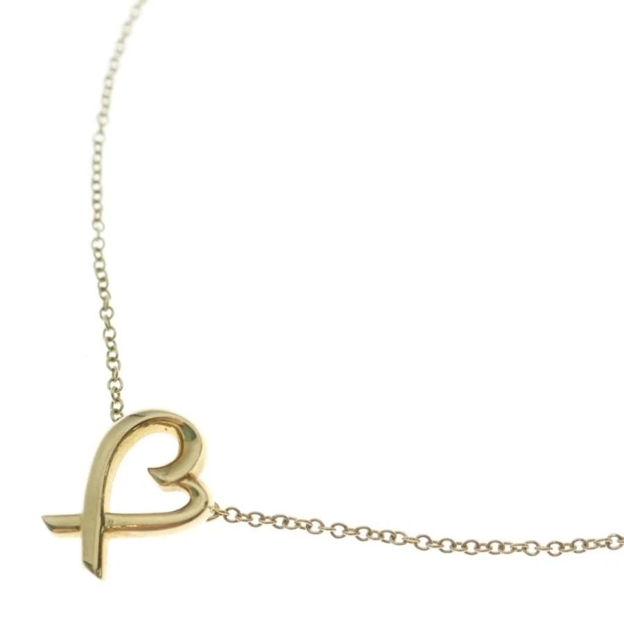 TIFFANY & CO. LOVING HEART K18 YELLOW GOLD NECKLACE: Tiffany & Co. Loving Heart K18 Yellow Gold Necklace Brand: Tiffany & Co. Type/Style: Necklace Material: Metal Purity K18, Metal Yellow Gold, Main Stone/Creation Natural Color: Yellow Gold Size: Ac