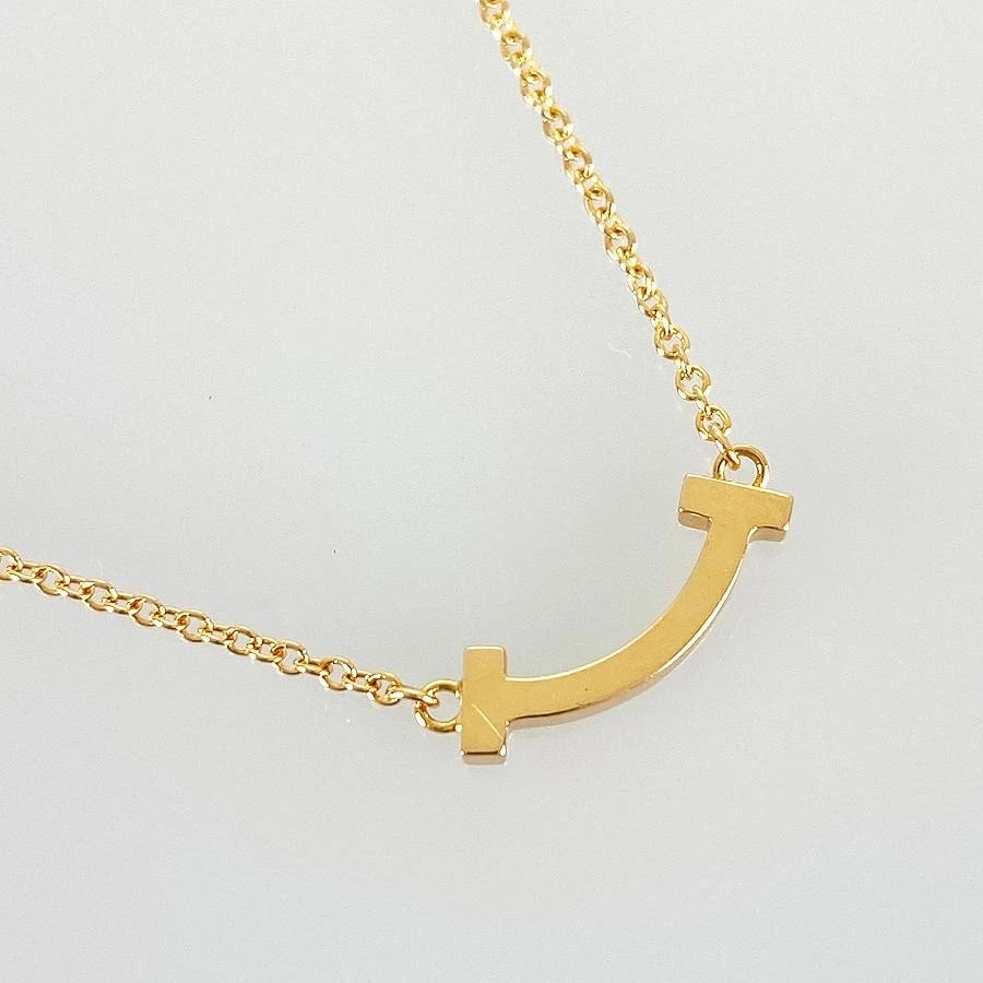 TIFFANY & CO. T SMILE K18 PINK GOLD UNISEX NECKLACE: Tiffany & Co. T Smile K18 Pink Gold Unisex Necklace Brand: Tiffany & Co. Type/Style: Necklace Material: Metal Purity K18, Metal Pink Gold, Main Stone/Creation Natural Color: Pink Gold Size: 4.5mm