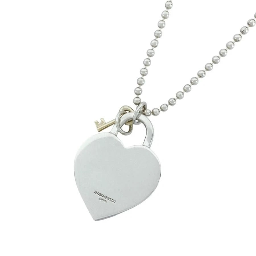 TIFFANY & CO. HEART LOCK KEY SV925 YG750 NECKLACE: Tiffany & Co. Heart Lock Key SV925 YG750 Necklace Brand: Tiffany & Co. Type/Style: Necklace Material: Metal Purity 925/750, Metal Silver/Yellow Gold, Main Stone/Creation Natural Color: Silver/Yello