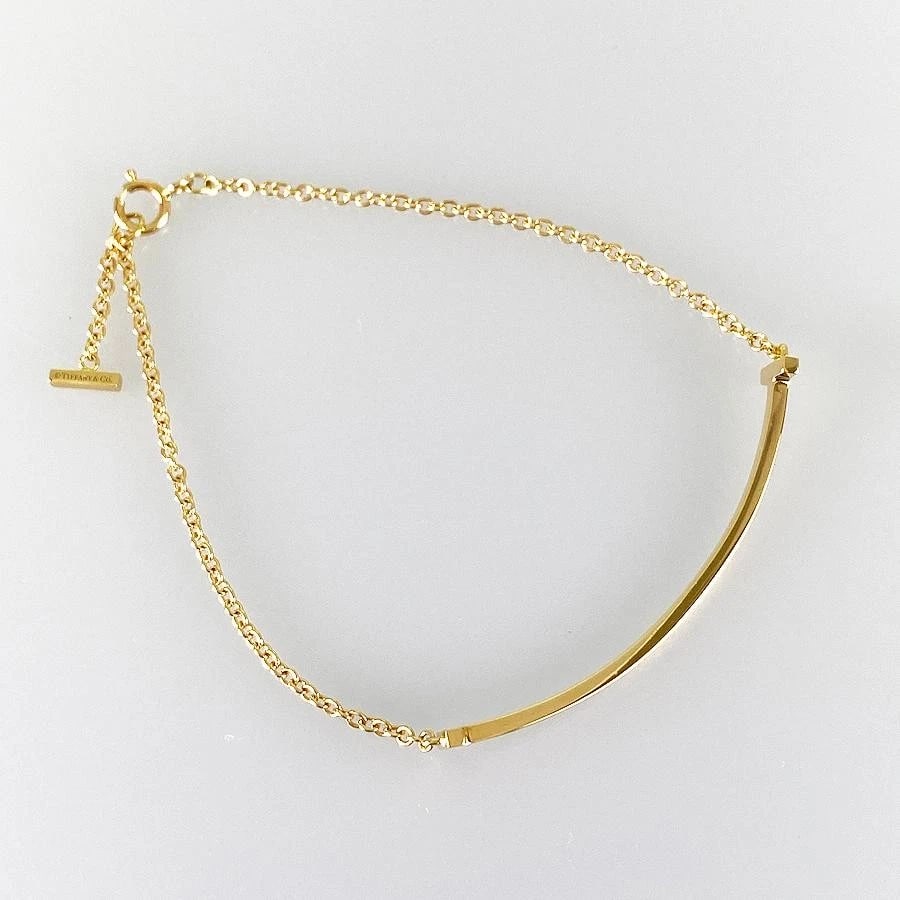 TIFFANY & CO. T SMILE K18 YELLOW GOLD BRACELET (1 of 5)