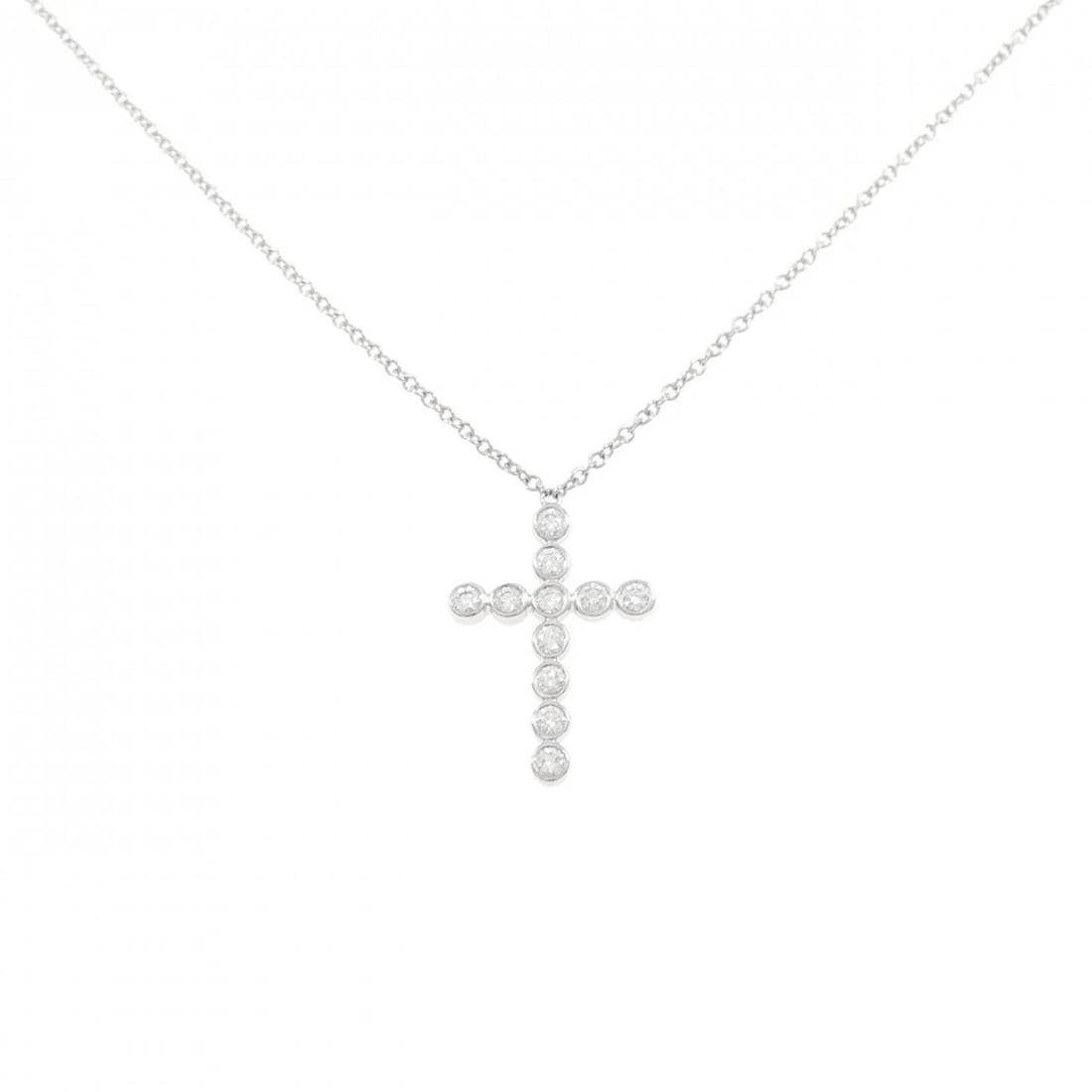 TIFFANY & CO. BEZEL CROSS MINI NECKLACE: Tiffany & Co. bezel Cross mini Necklace Brand: Tiffany Type: Necklace Material: Platinum 950, Main Stone/Creation Natural Color: White Size: 41cmActualSize Pendant top H x W: 17.2mmx12.2mm Chain M